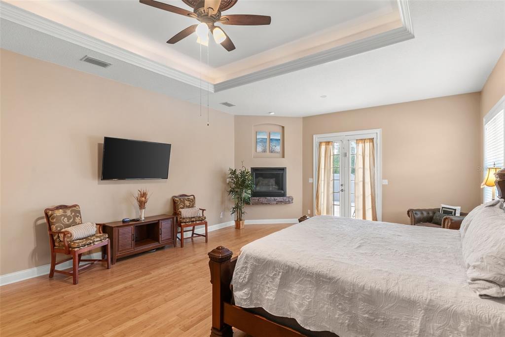 12080 143rd Street North Largo, FL 33774 - Photo 21 of 49 a bedroom with furniture and a flat screen tv