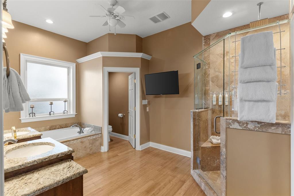 12080 143rd Street North Largo, FL 33774 - Photo 22 of 49 a spacious bathroom with a granite countertop sink mirror and shower