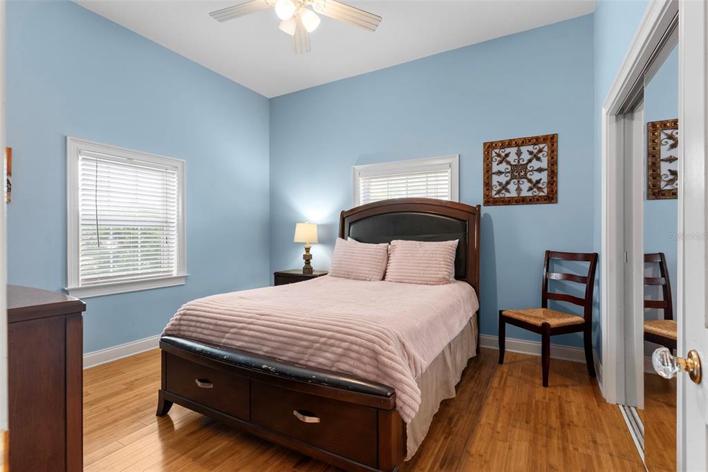 12080 143rd Street North Largo, FL 33774 - Photo 25 of 49 a bedroom with a bed wall painting and a window