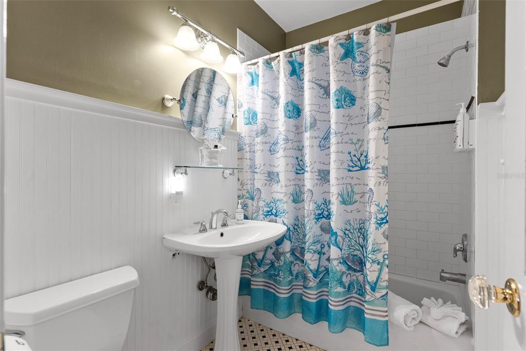 12080 143rd Street North Largo, FL 33774 - Photo 27 of 49 a bathroom with a sink toilet and shower