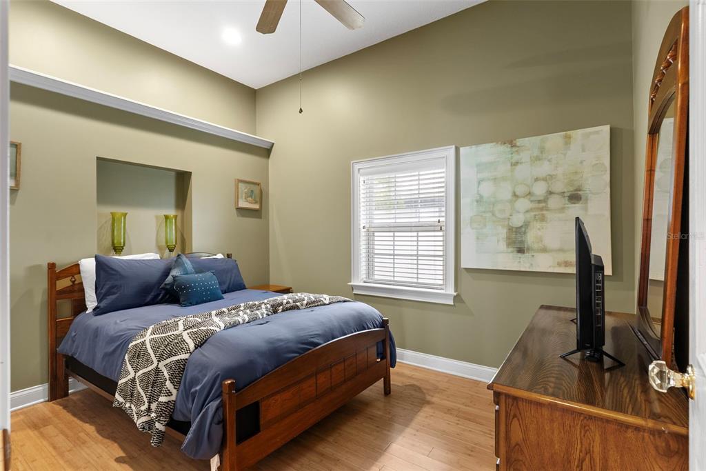 12080 143rd Street North Largo, FL 33774 - Photo 28 of 49 a bedroom with a bed and a flat screen tv