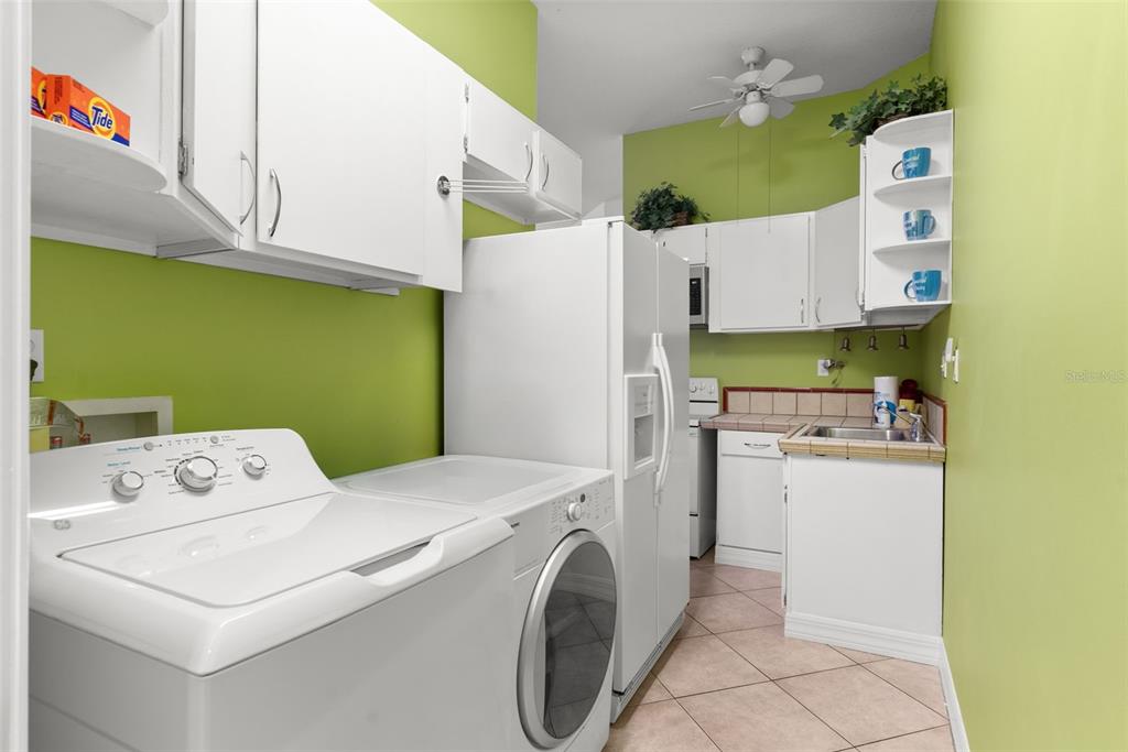12080 143rd Street North Largo, FL 33774 - Photo 30 of 49 a utility room with dryer and washer