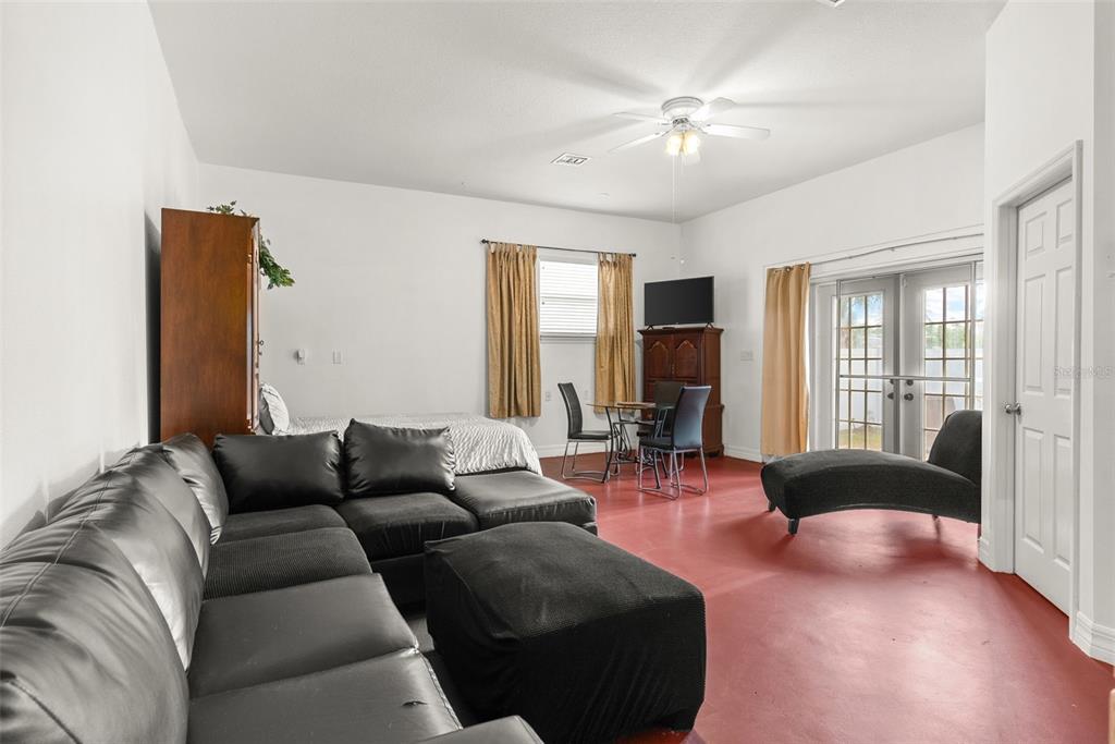 12080 143rd Street North Largo, FL 33774 - Photo 32 of 49 a living room with furniture and a chandelier
