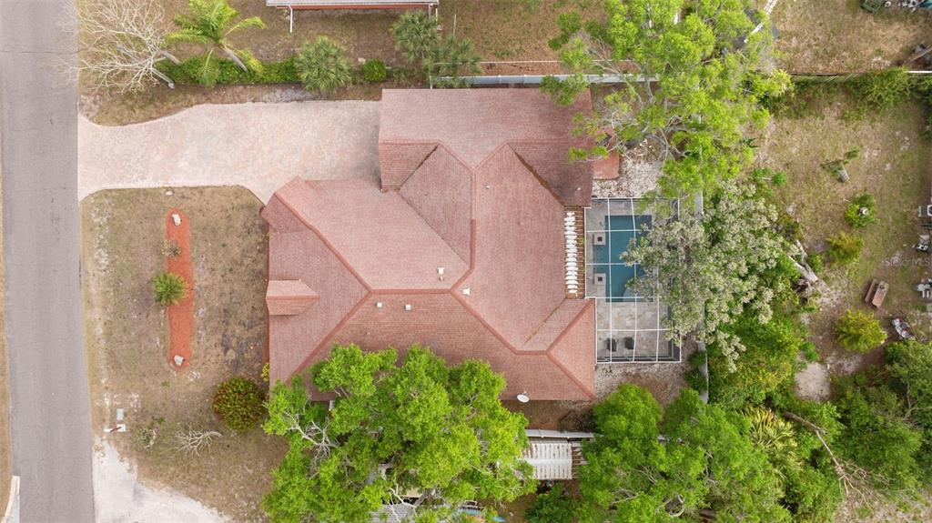 12080 143rd Street North Largo, FL 33774 - Photo 38 of 49 an aerial view of a house with plants and large trees