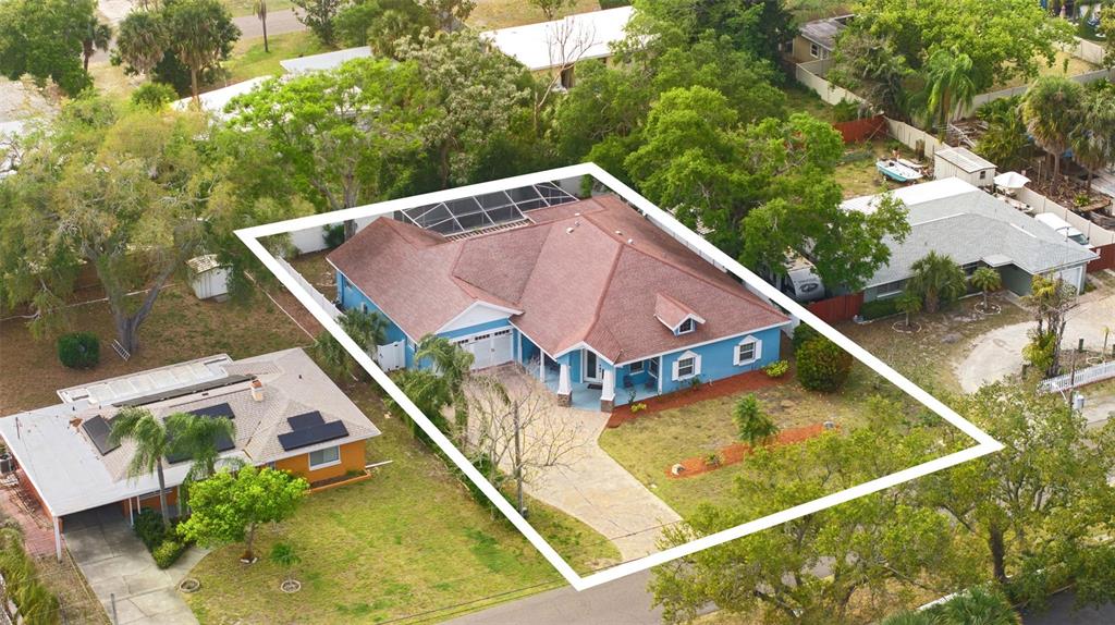 12080 143rd Street North Largo, FL 33774 - Photo 5 of 49 an aerial view of a house with a swimming pool