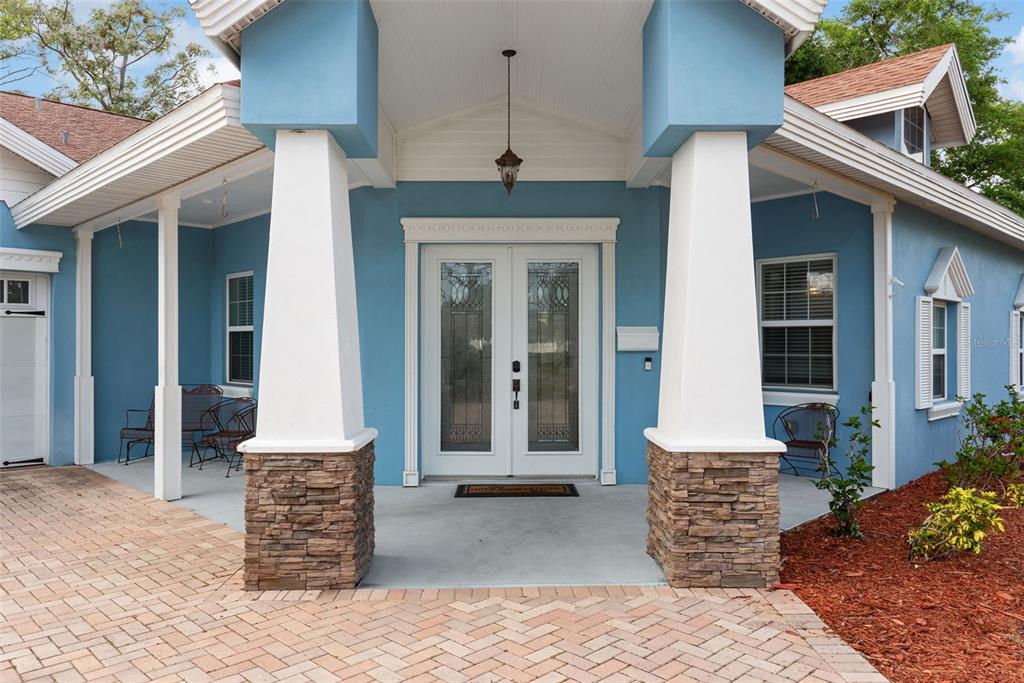 12080 143rd Street North Largo, FL 33774 - Photo 7 of 49 a front view of a house with a porch