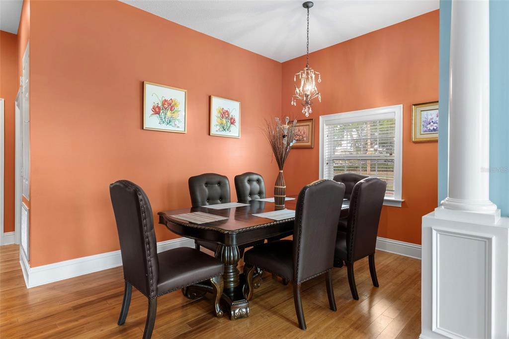 12080 143rd Street North Largo, FL 33774 - Photo 10 of 49 a view of a dining room with furniture window and wooden floor