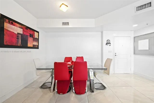 a living room with furniture a table and a painting