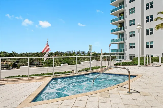 a view of a swimming pool with a lounge chair