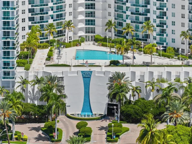 a picture of a building with a lot of plants and flowers