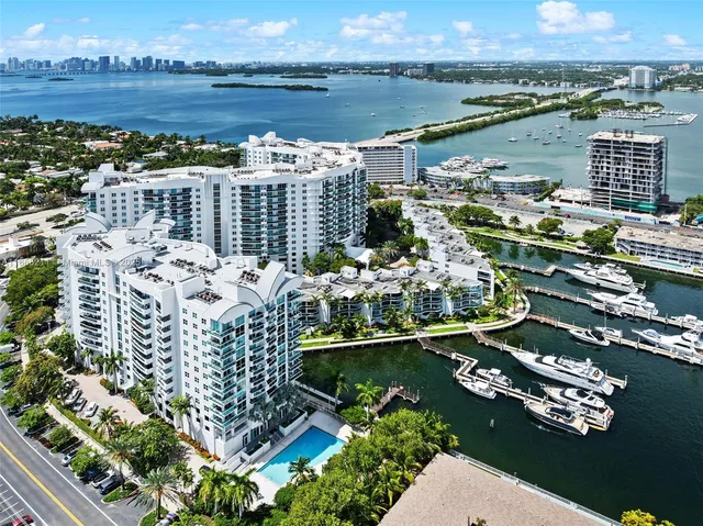 a view of a lake with tall building
