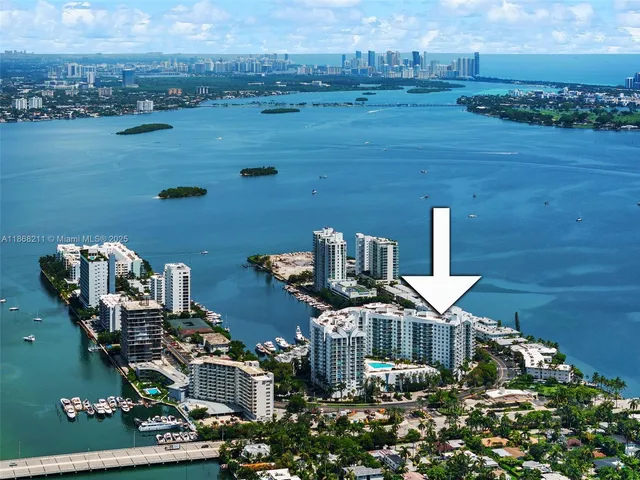 a view of a lake with lawn chairs