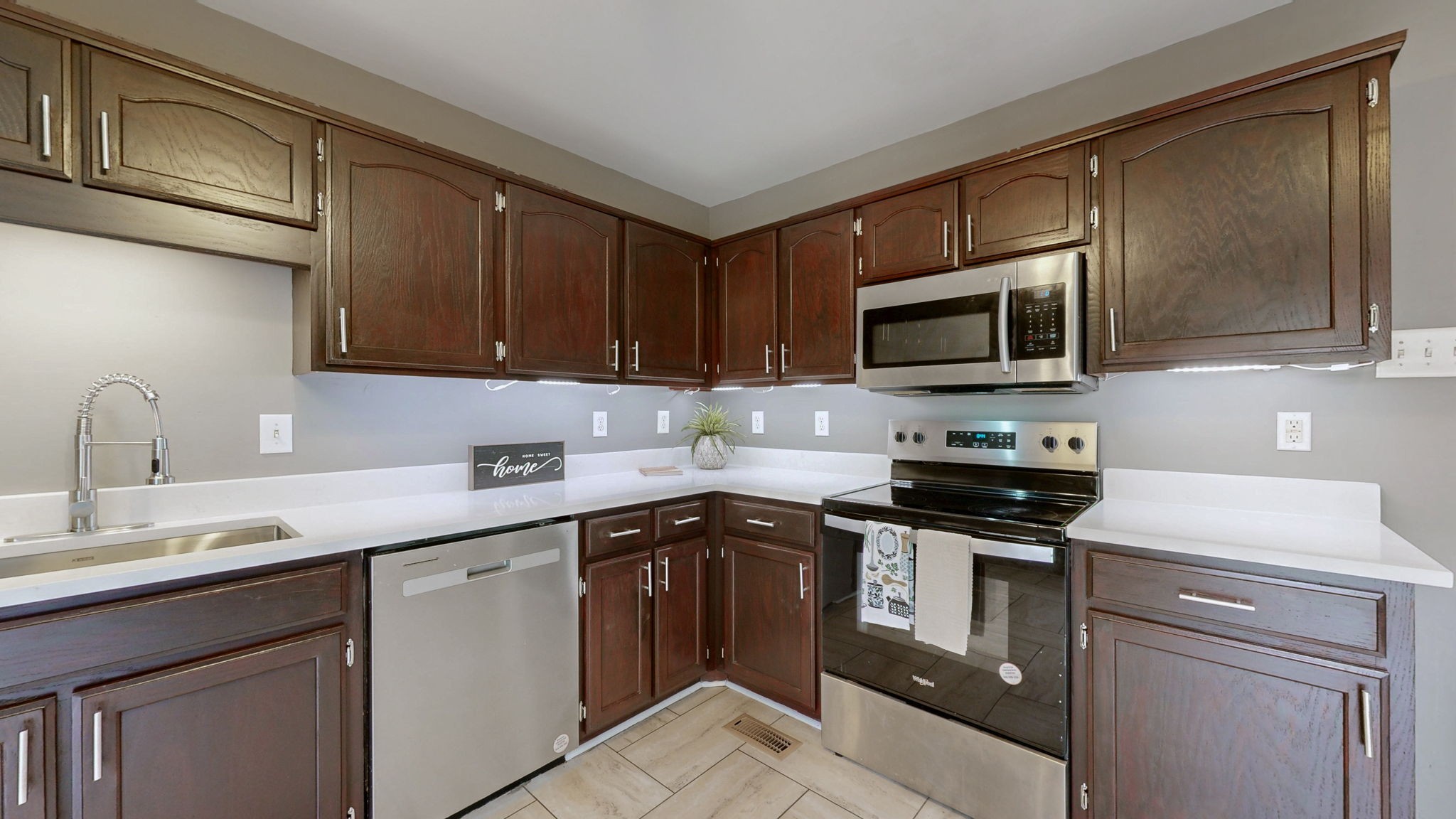 132 Ben Drive Springfield, TN 37172 - Photo 2 of 35 a kitchen with stainless steel appliances granite countertop a sink stove and microwave