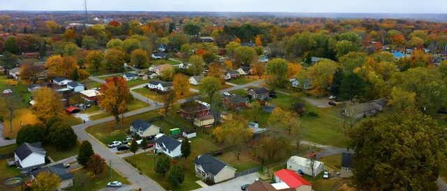 an aerial view of residential houses with outdoor space