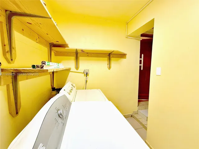 a view of a bathroom with a tub and a shower