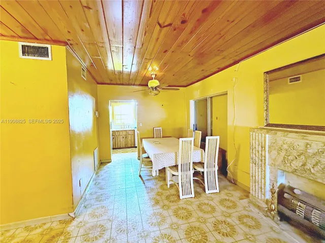 a dining room with a table and chairs