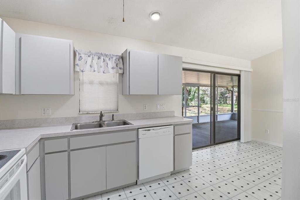 6355 East Rush Street Inverness, FL 34452 - Photo 9 of 27 a kitchen with a sink stove and cabinets