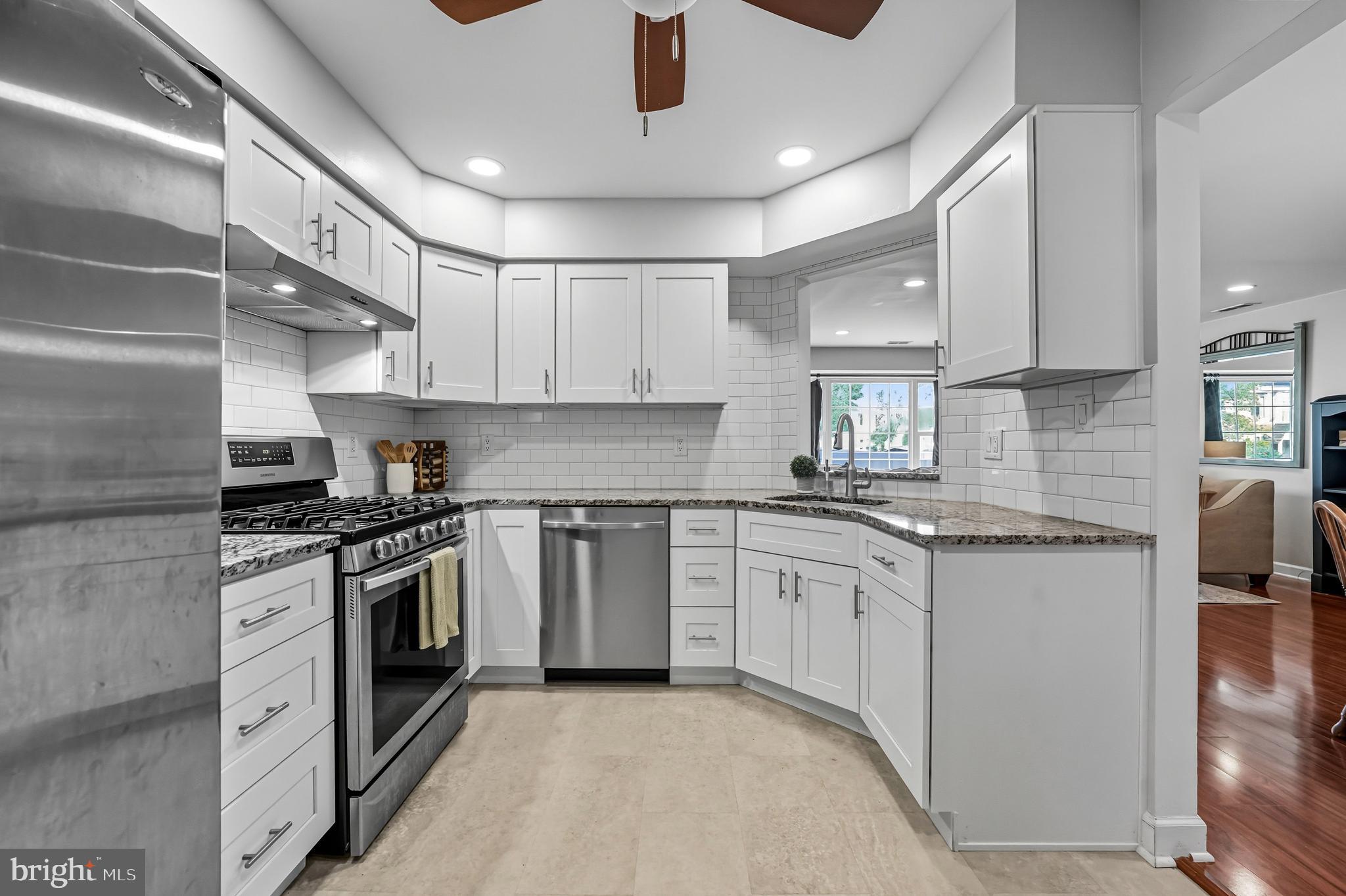 1603 Wharton Road Mount Laurel, NJ 08054 - Photo 17 of 39 a kitchen with stainless steel appliances granite countertop a stove sink and cabinets