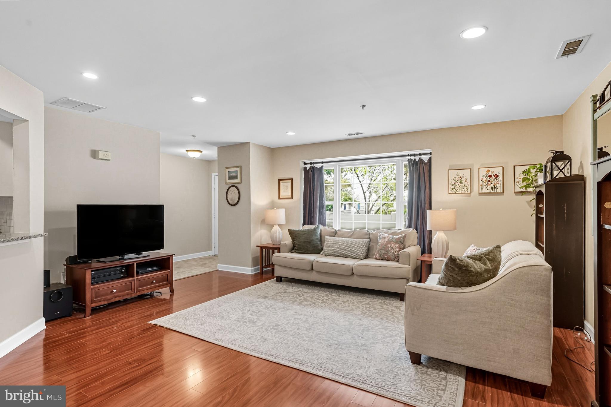 1603 Wharton Road Mount Laurel, NJ 08054 - Photo 8 of 39 a living room with furniture and a flat screen tv