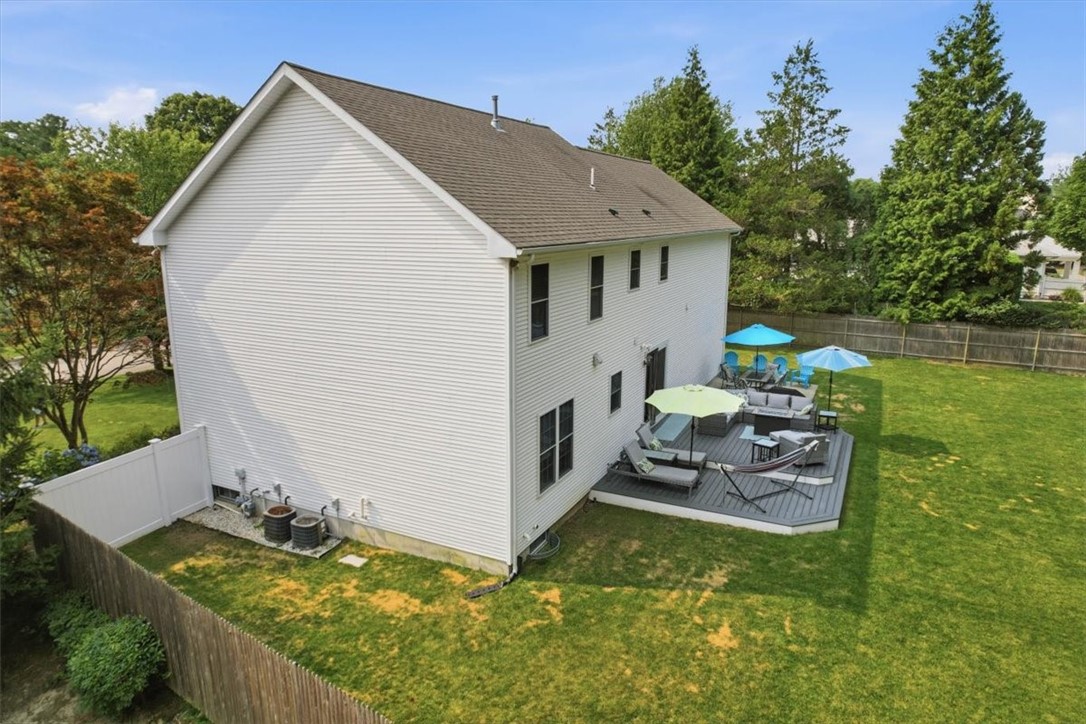 26 Davis Circle Warwick, RI 02886 - Photo 47 of 50 Maintenance-free composite deck, ideal for long-term durability and low upkeep. Fully fenced yard with a large storage shed.