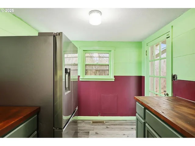 a view of kitchen with furniture and a window