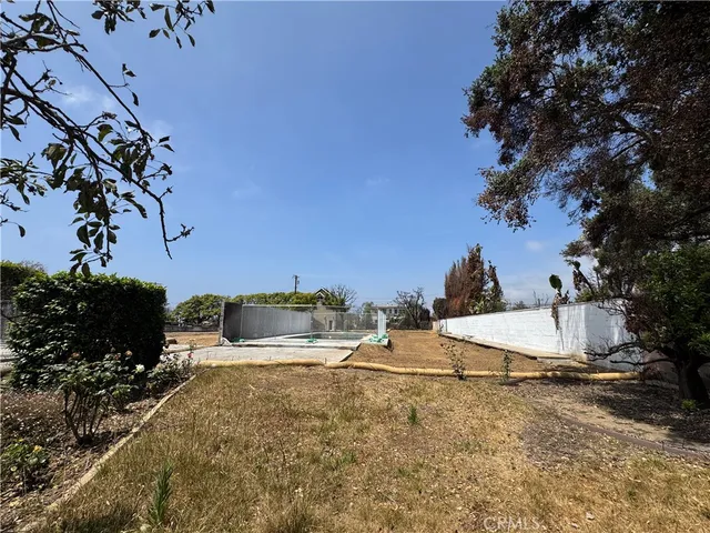 a view of a swimming pool with a patio