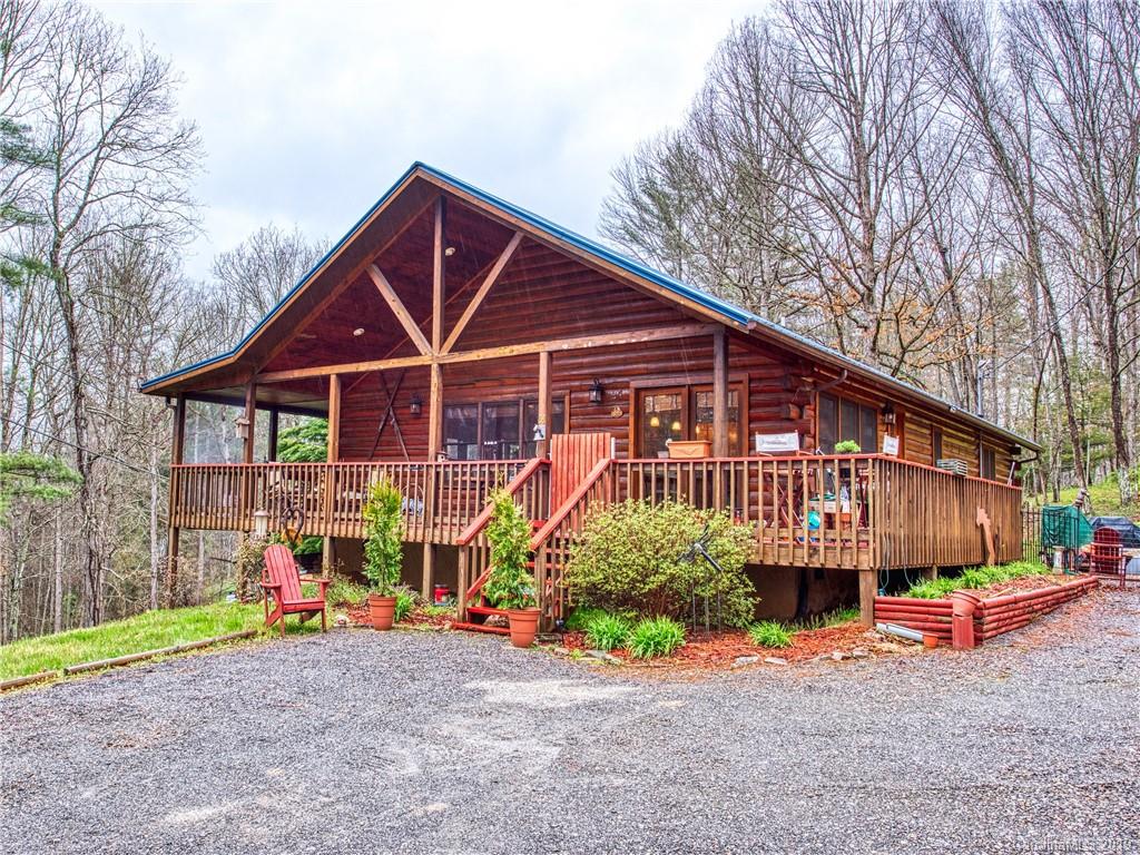 24 Thistle Ridge Clyde, NC 28721 - Photo 1 of 18 a view of a big house with large trees and wooden fence