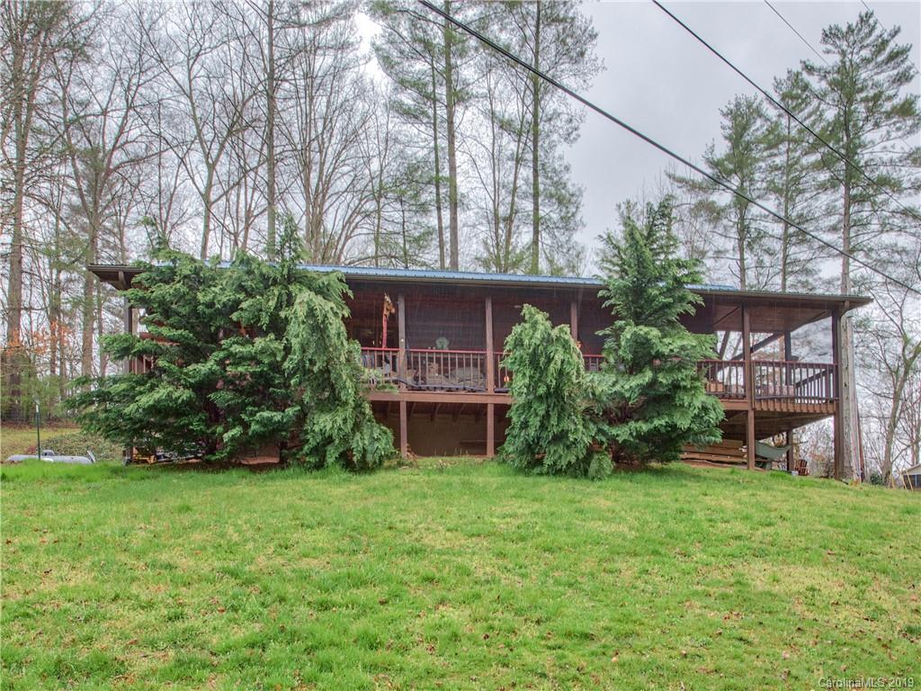 24 Thistle Ridge Clyde, NC 28721 - Photo 2 of 18 a view of a house with a yard and a tree