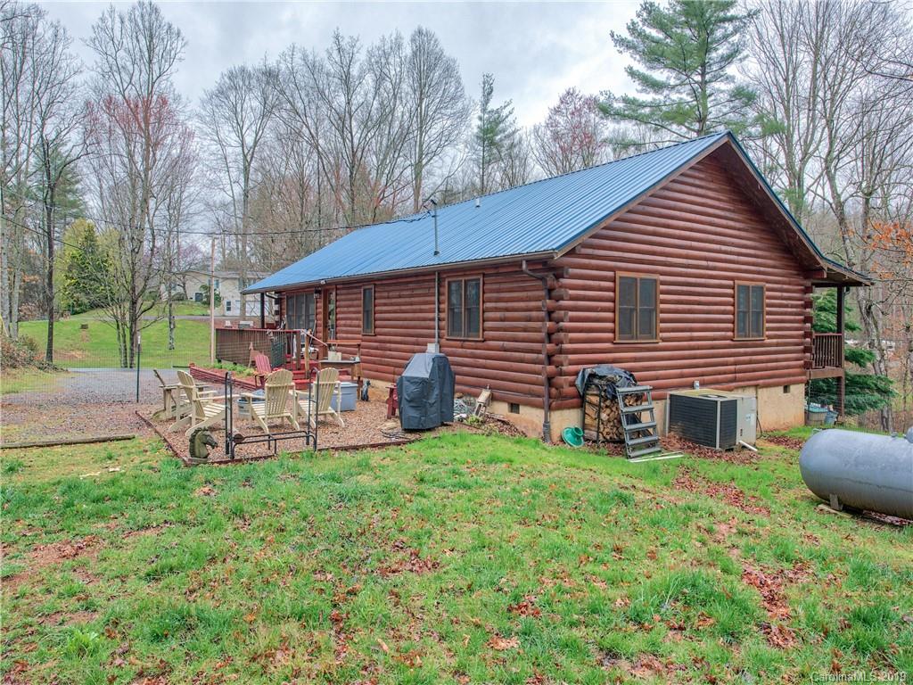 24 Thistle Ridge Clyde, NC 28721 - Photo 3 of 18 a view of a house with a yard and sitting area