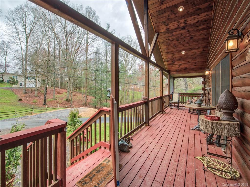 24 Thistle Ridge Clyde, NC 28721 - Photo 4 of 18 a view of balcony with wooden floor and outdoor seating