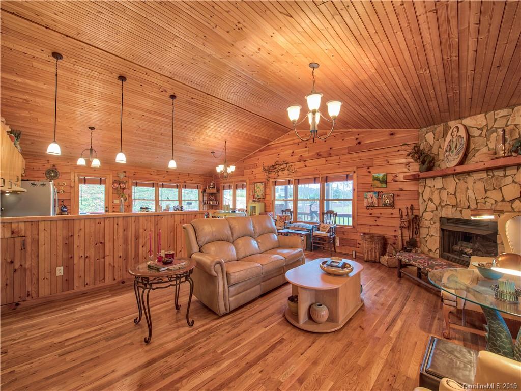 24 Thistle Ridge Clyde, NC 28721 - Photo 7 of 18 a outdoor living space with patio furniture and a fireplace