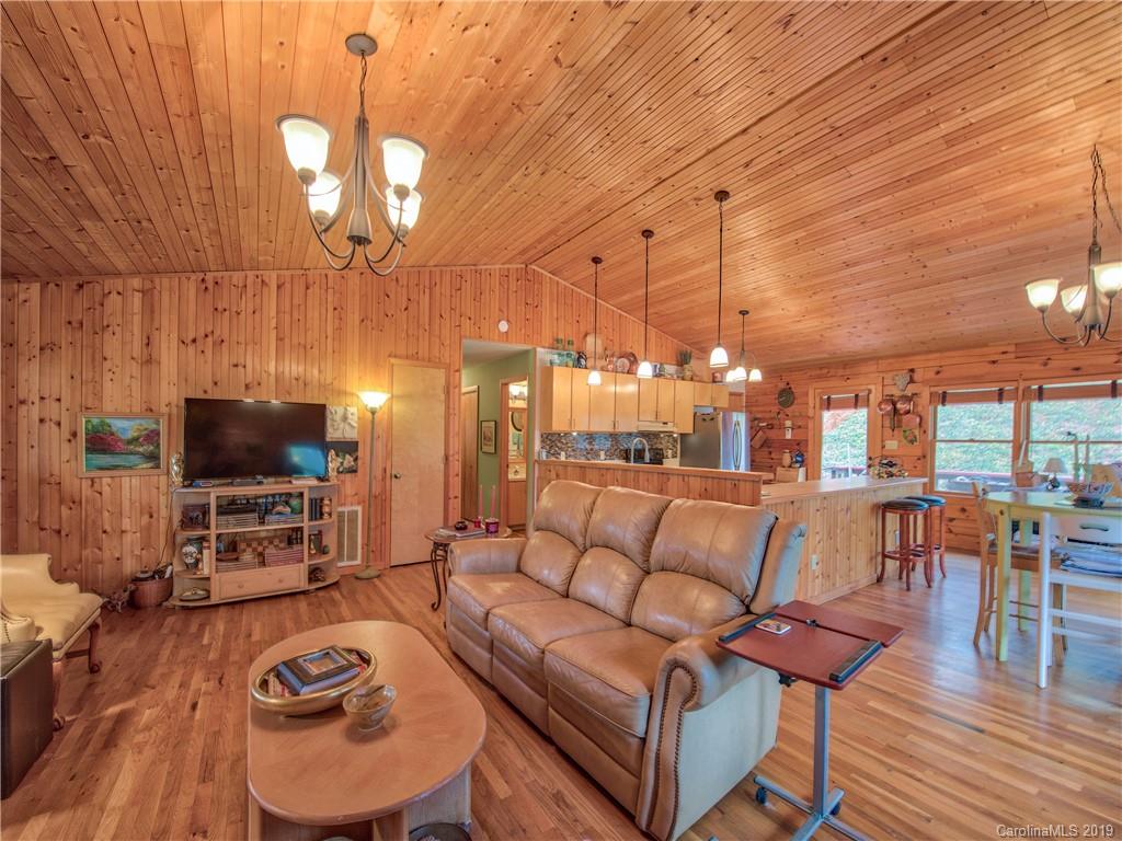 24 Thistle Ridge Clyde, NC 28721 - Photo 8 of 18 a living room with furniture and a flat screen tv