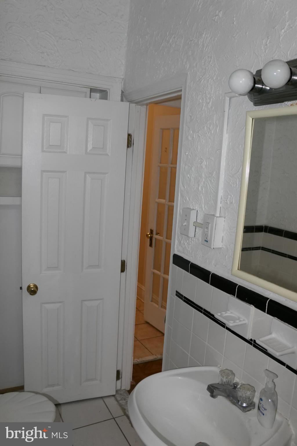 642 8th Street Northeast Washington, DC 20002 - Photo 11 of 29 a bathroom with a sink and a mirror