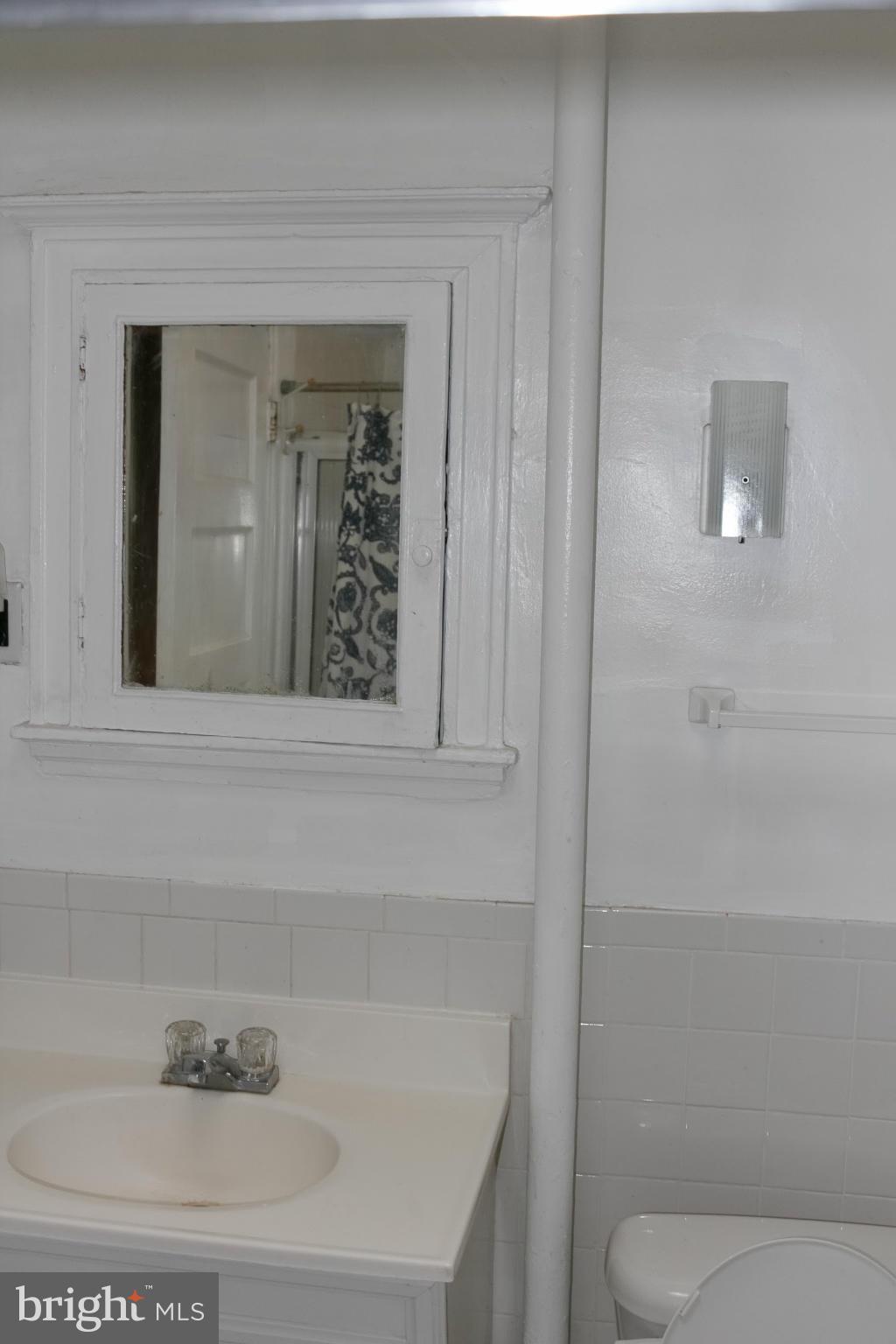 642 8th Street Northeast Washington, DC 20002 - Photo 15 of 29 a bathroom with a sink a toilet and shower