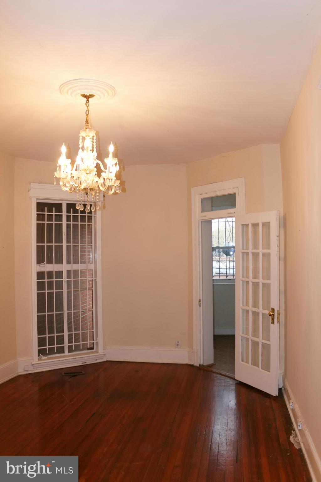 642 8th Street Northeast Washington, DC 20002 - Photo 7 of 29 a view of an empty room with wooden floor and a window