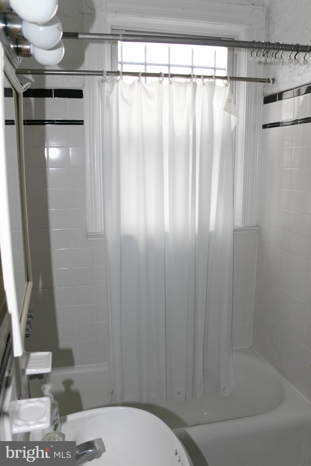 642 8th Street Northeast Washington, DC 20002 - Photo 10 of 29 a bathroom with a shower and a sink