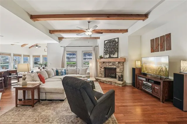a view of a dining room with furniture wooden floor and chandelier