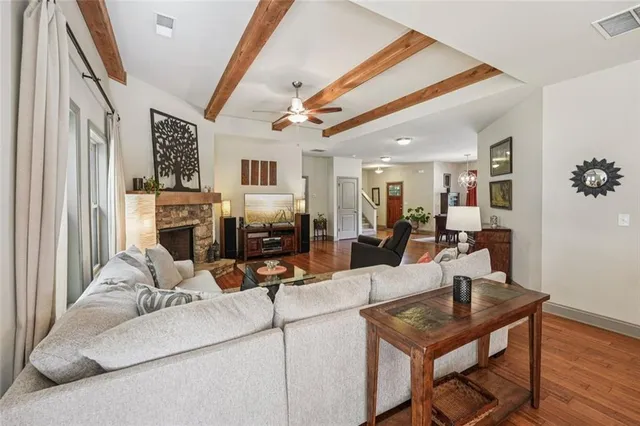 a bathroom with a sink vanity mirror and toilet