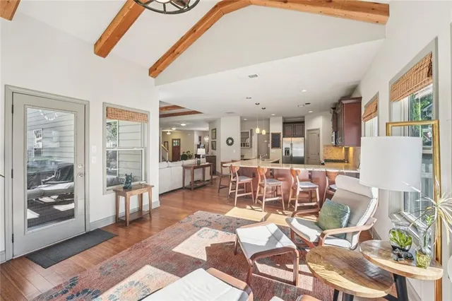 a view of a livingroom with workspace and a couch