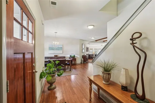 a living room with fireplace furniture and a wooden floor