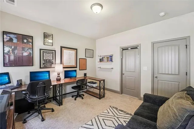 a view of walk in closet with clothes