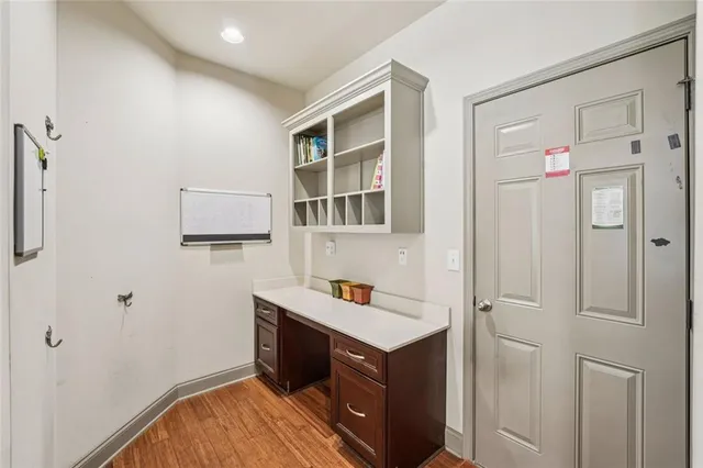 a view of walk in closet with clothes