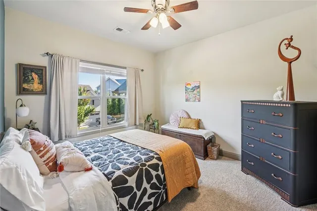 a spacious bathroom with a tub sink shower and mirror