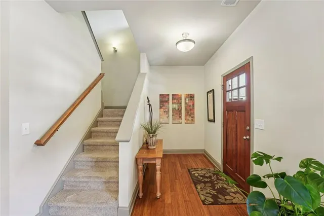 a kitchen with a sink stove and wooden cabinets