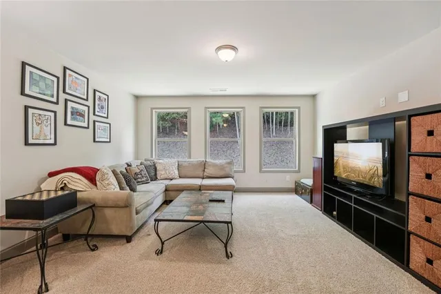 a view of a house with backyard porch and sitting area