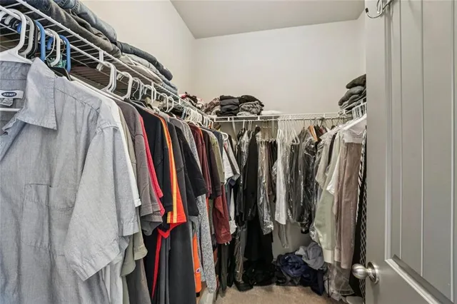 an aerial view of a house with a yard and trees