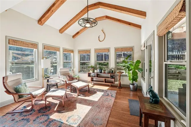 a view of a dining room with furniture window and wooden floor