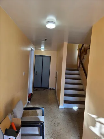 a view of entryway with stairs and furniture