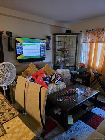 a bedroom with two beds and a window