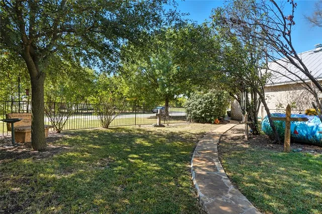 a view of a swimming pool with sitting area